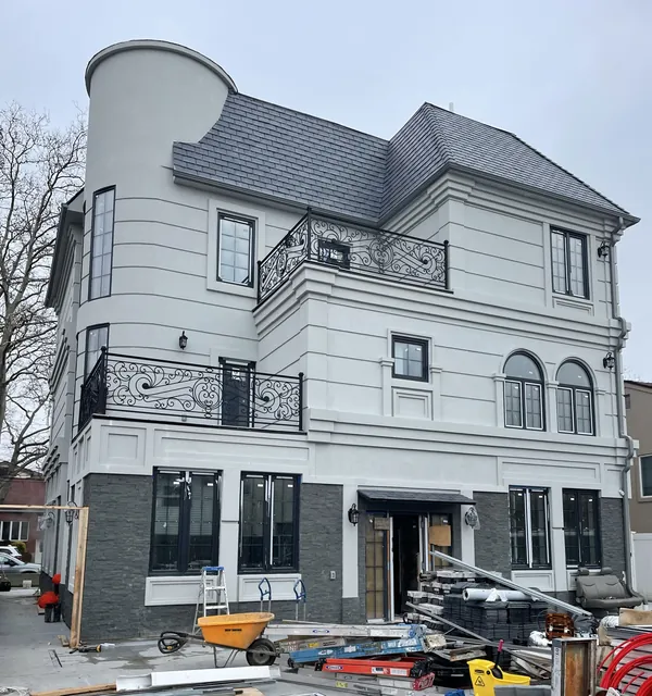 Three-story home with wrought-iron balconies
