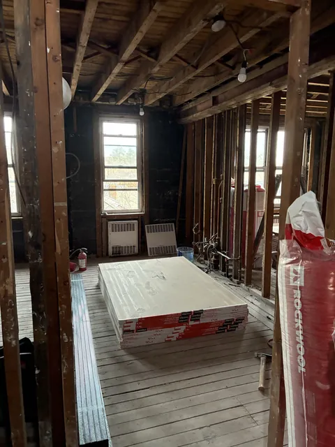Before: room stripped to the framing